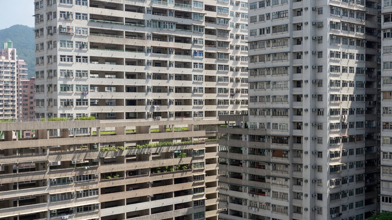 公屋史:徙置區 → 雙塔 → 和諧式 → 居屋 · 圖1